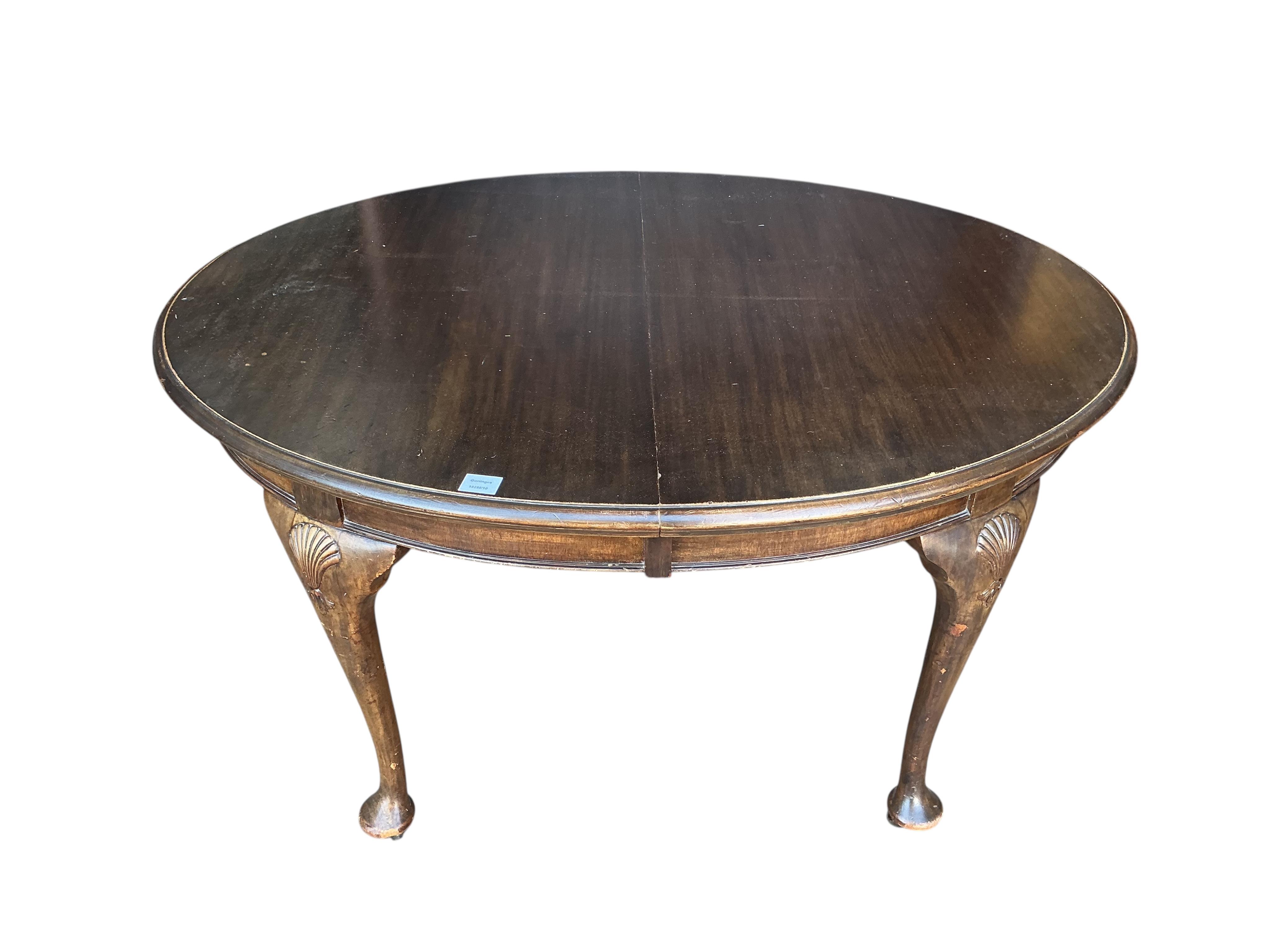 A Chippendale Revival mahogany extending dining table, 210cm extended, two spare leaves, depth 106cm, height 74cm together with a set of six Chippendale Revival mahogany dining chairs, two with arms